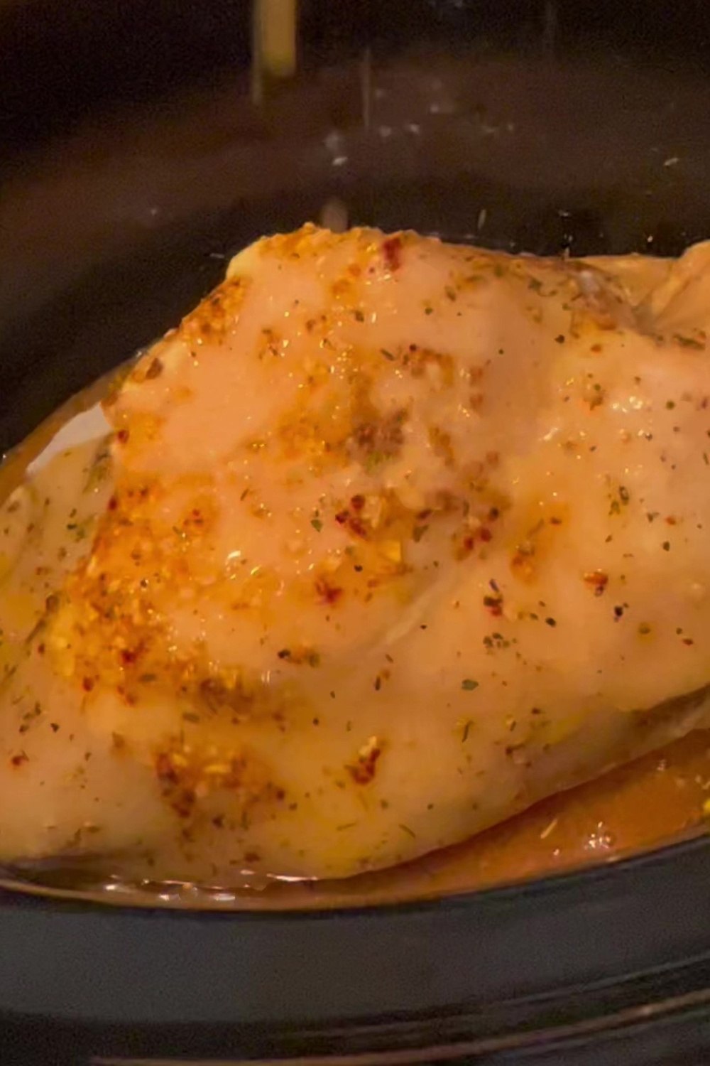 a close up of chicken in a pot 