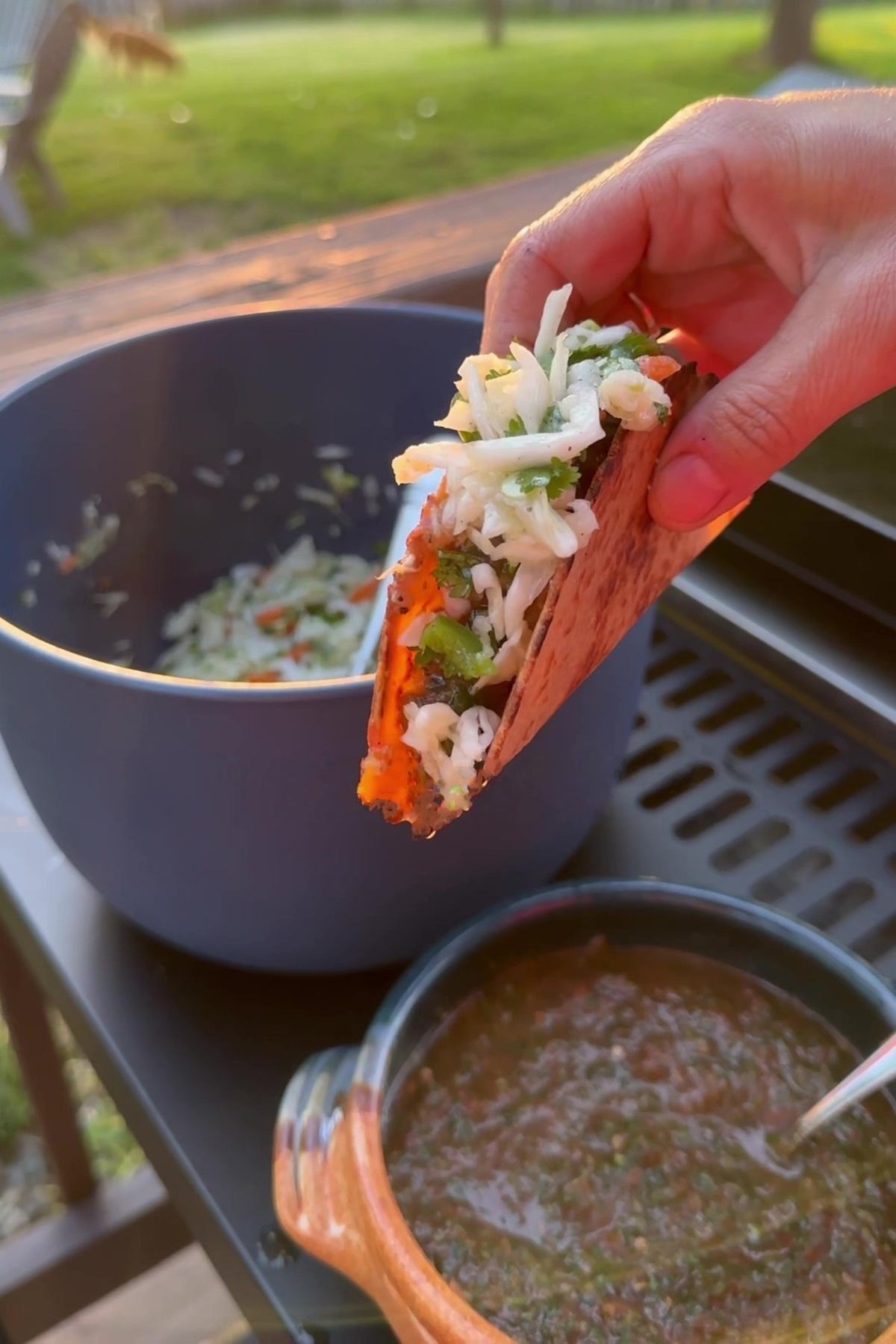 hand holding chicken mexican tacos